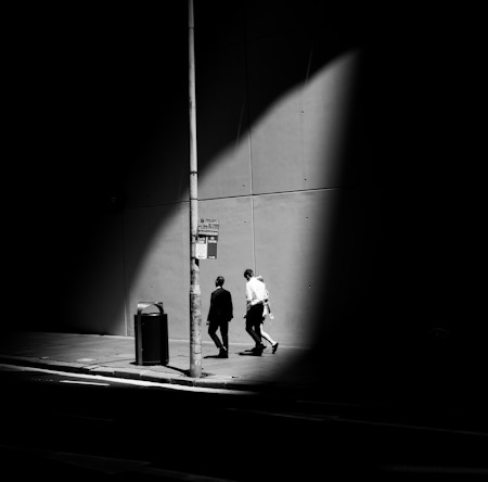 Morning sun light spotlighting office workers