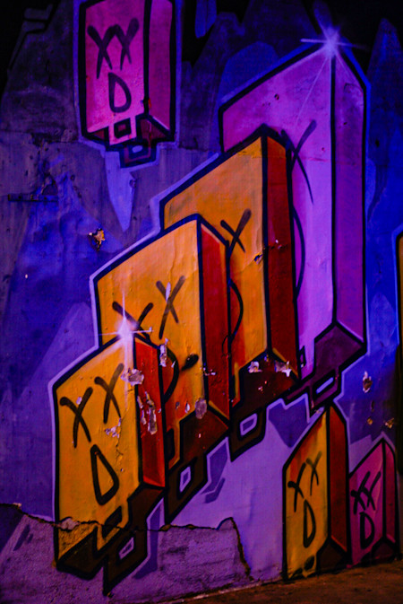 Amazing graffiti next to a bar entrance