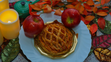 Autumn table with apples and apple pie