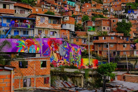 Comuna 13 with its vibrant colors and beautiful graffiti on the hillside