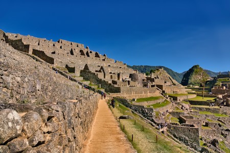 A pathway winding through the historic Inca citadel of Machu Picchu in the Peruvian Andes