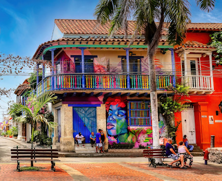 A street scene in Cartagena with its brightly colored buildings and graffiti