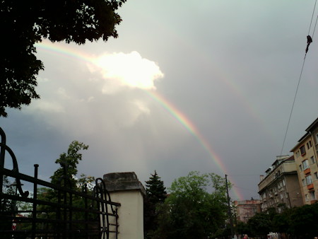 Architecture, Building, Nature, Outdoors, Person, Rainbow, Sky, Sreet